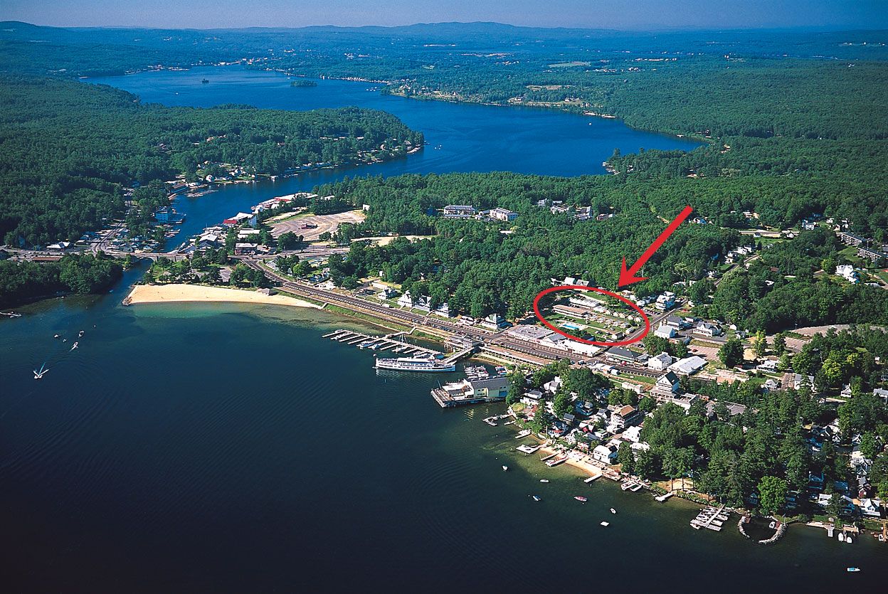 Aerial of Weirs Beach with Half Moon Motel & Cottages indicated with red oval